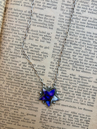Purple Mohave star pendant set in sterling silver on an 18-inch sterling silver chain.