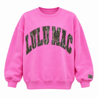 Bubble gum pink Lulu Mac crewneck sweatshirt with Mossy Oak Bottomland camouflage lettering on a white background.