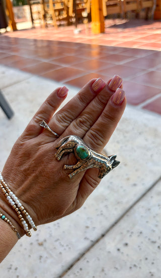 Western donkey pendant featuring a turquoise stone accent with detailed engraved metalwork.