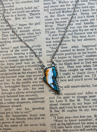 Spiny oyster and turquoise inlay lightning bolt necklace set in sterling silver.