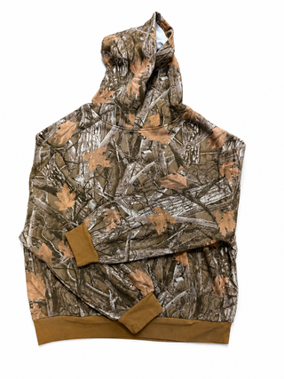 Brown and tan woodland camo hoodie featuring an allover tree branch and leaf print with solid brown ribbed cuffs and hem.