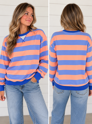 Sunday Drive peach and periwinkle blue striped sweatshirt with royal blue trim on model