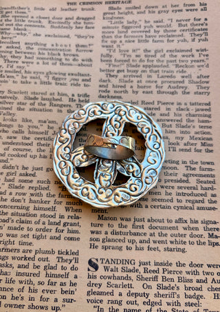 Large peace sign ring featuring multiple natural turquoise stones in shades of blue and green, set in an ornate silver-tone design with a wide band.