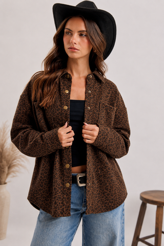 Brown leopard print oversized shacket with button front, collar, chest pocket, and long sleeves.