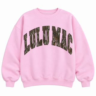 Light pink Lulu Mac crewneck sweatshirt with oversized Mossy Oak Bottomland camo lettering across the front.