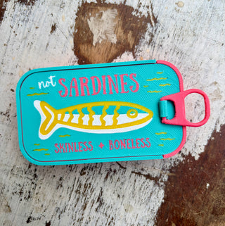 Colorful sardine tin travel jewelry organizers in assorted colors