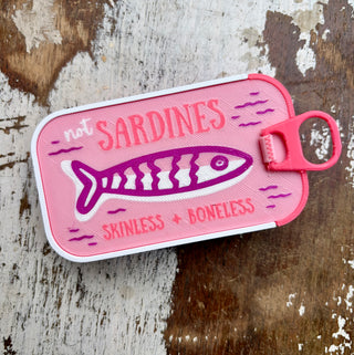 Colorful sardine tin travel jewelry organizers in assorted colors