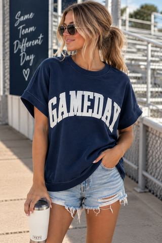 Model wearing navy Gameday oversized short sleeve sweatshirt tee with white varsity lettering
