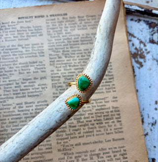 Adjustable gold-plated sterling silver wrap ring with two green Sonoran turquoise stones in rounded triangular settings with beaded borders.