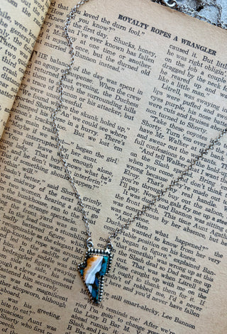 Spiny oyster and turquoise inlay lightning bolt necklace set in sterling silver.