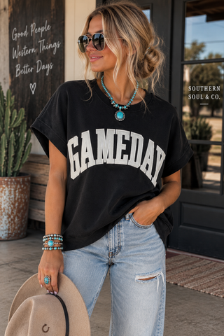 Model wearing black Gameday oversized short sleeve sweatshirt tee with light wash jeans and turquoise jewelry