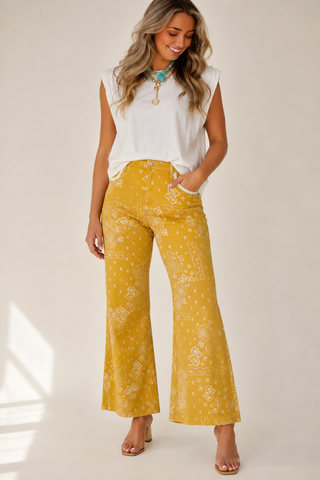 Mustard yellow bandana print wide leg jeans on model