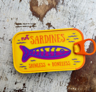 Colorful sardine tin travel jewelry organizers in assorted colors