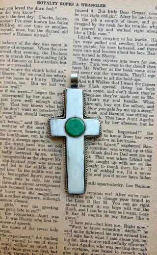 Alloy cross pendant featuring water buffalo bone and a round turquoise center stone with Western detailing.
