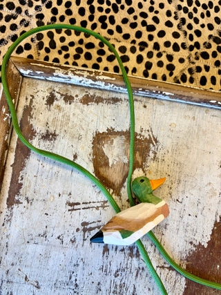Mallard duck bolo tie with green cord and brown tassel ends