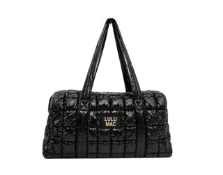 Black quilted Lulu Mac puffer bag with handles and a logo patch on the front.