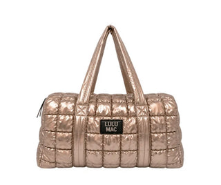 Metallic champagne quilted Lulu Mac puffer bag with handles and a logo patch on the front.